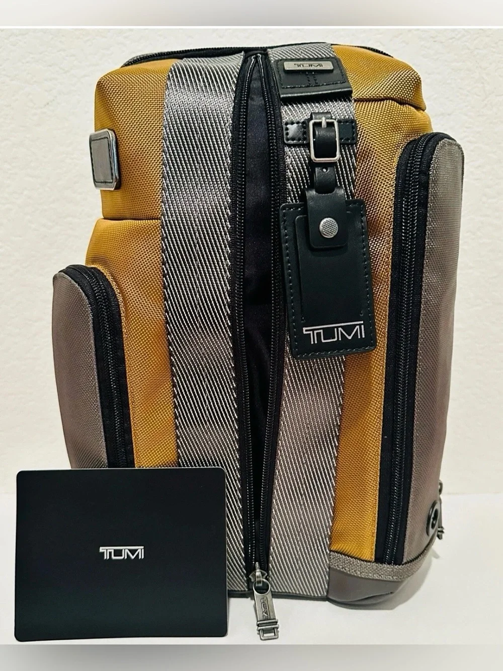 Brand New with Tag TUMI Higgins Sling Golden Brown Gray